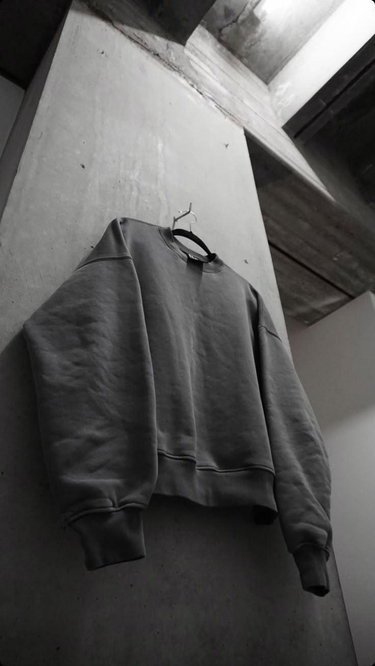 Sweatshirt against concrete